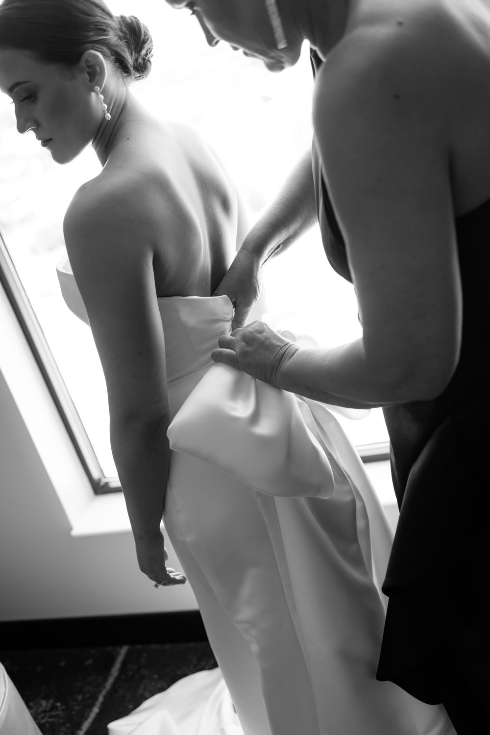 Intimate wedding moments captured in soft black and white photography.