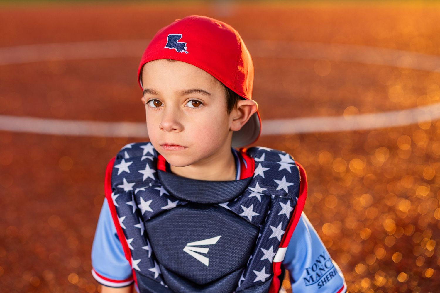 Youth baseball portrait using off-camera flash during a team media day in Lake Charles, LA. Ballistics at Westlake High School Field