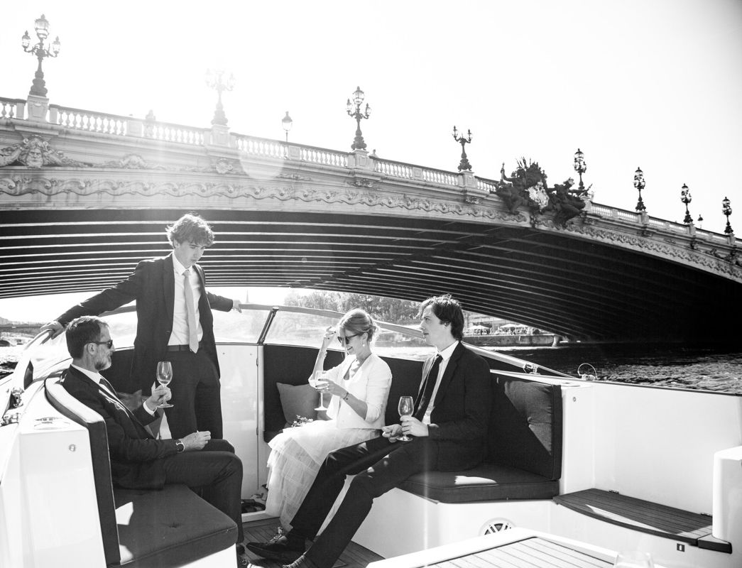 A series of black and white images showing a person climbing over a bridge railing in an artistic sequence.