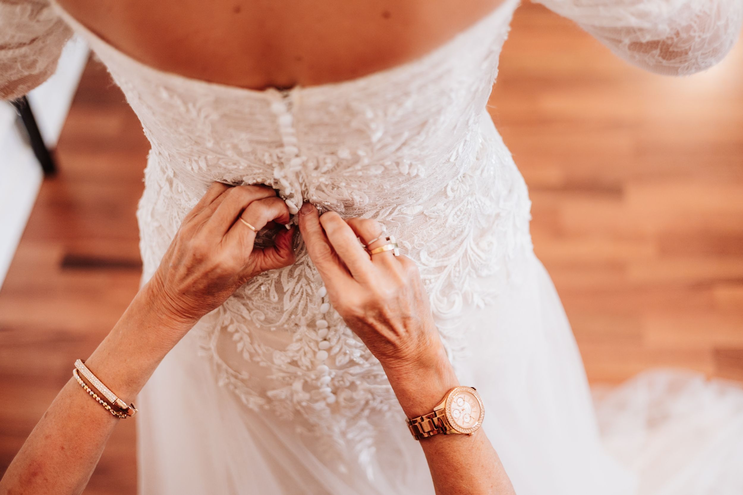 Close-up shot of hands exchanging wedding rings during a romantic ceremony.