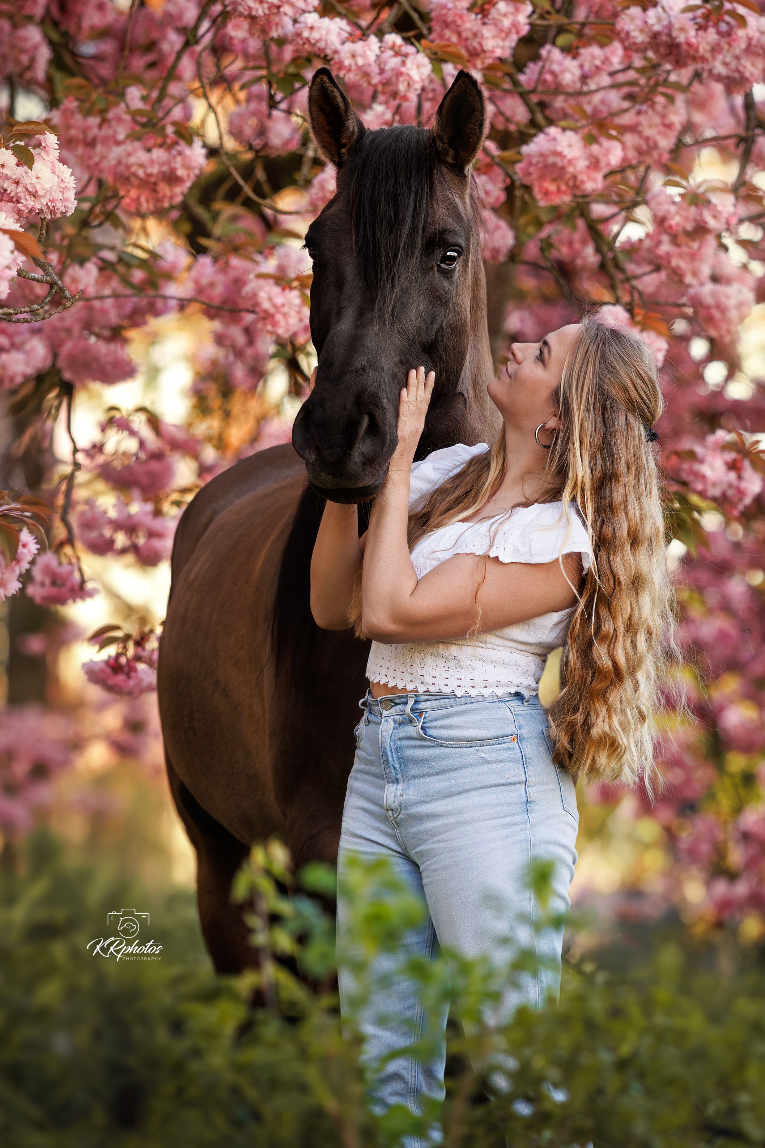 Cruzado with woman in dress in cherry blossom