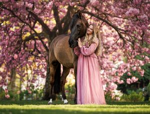 Cruzado with woman in dress in cherry blossom