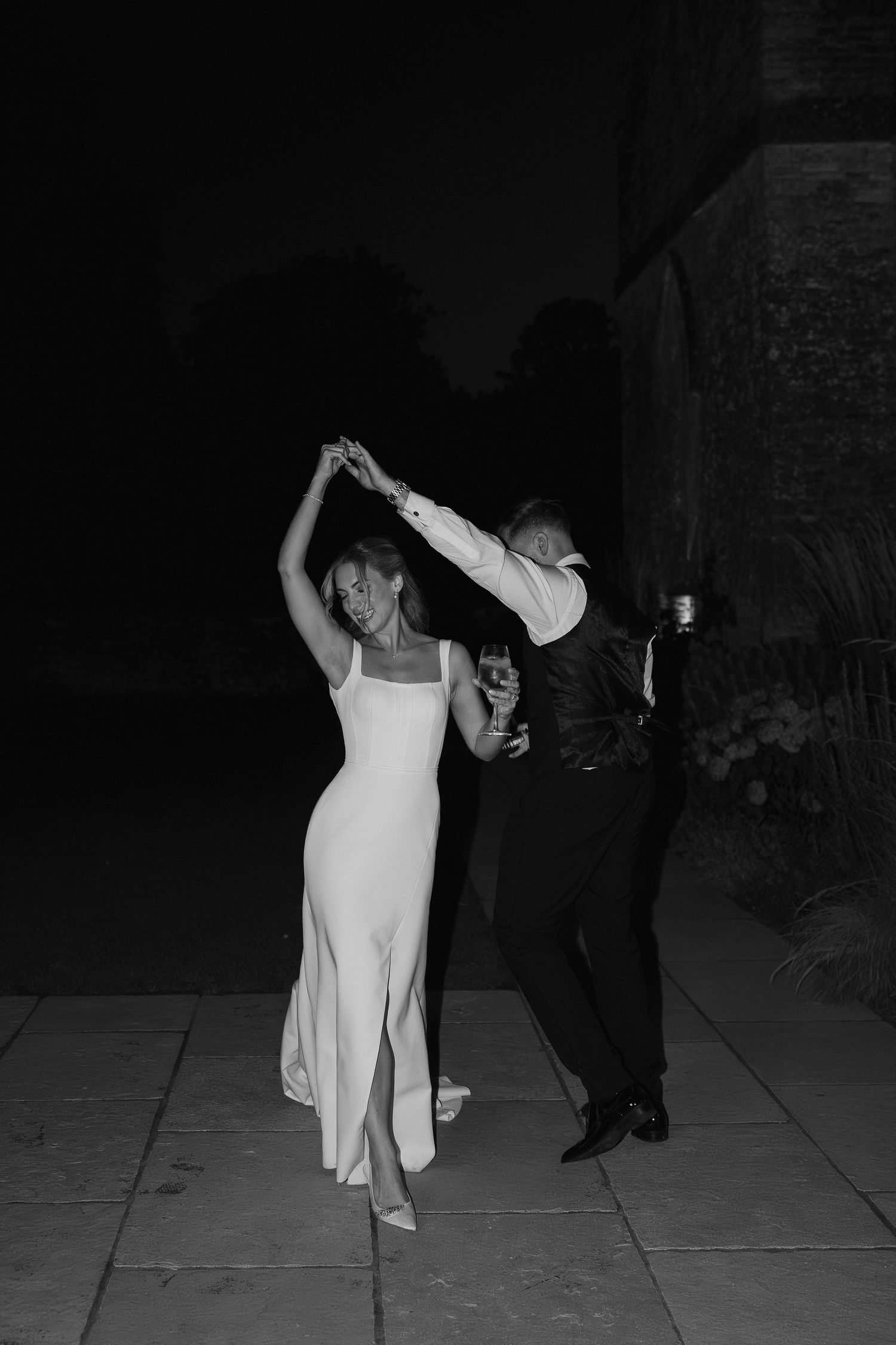 groom twirling bride at ivy lodge wedding in cirencester