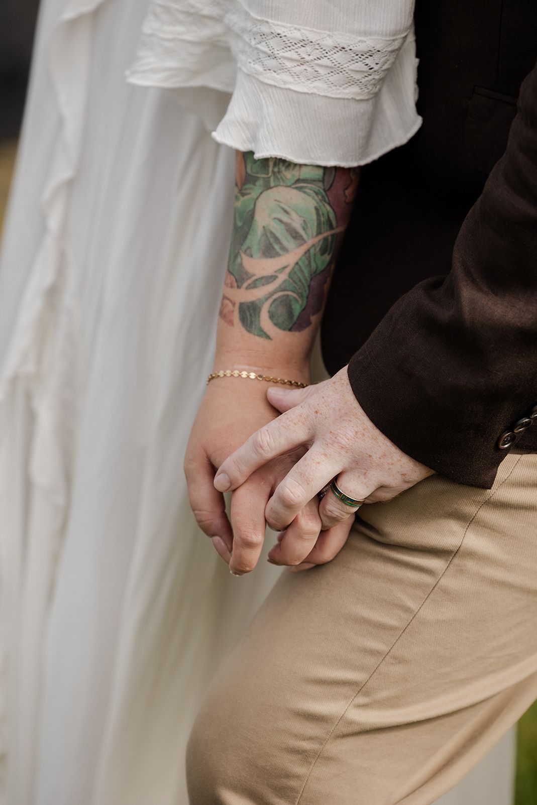 Couple holding hands at Hags Head Cliffs of Moher elopement