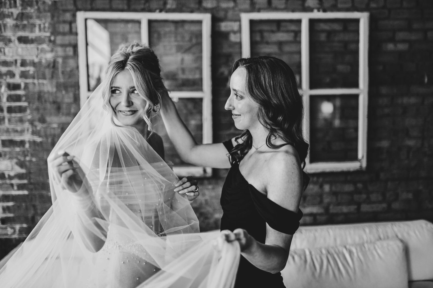 Bride adjusting veil before ceremony