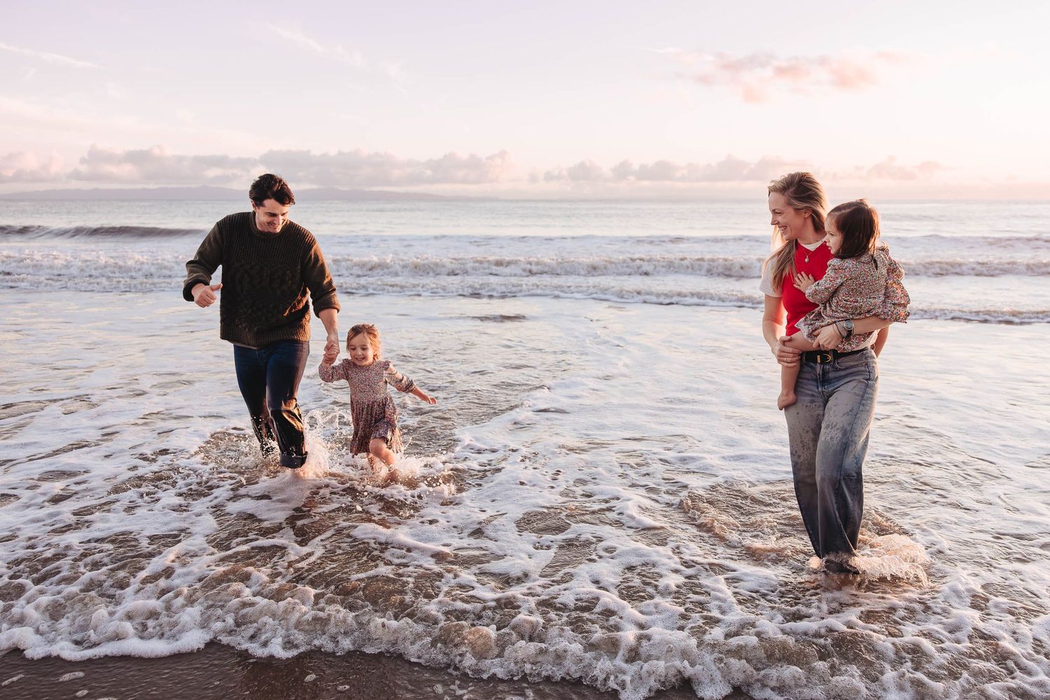 A series of beach photos showing people playing and splashing in the ocean waves at sunset.