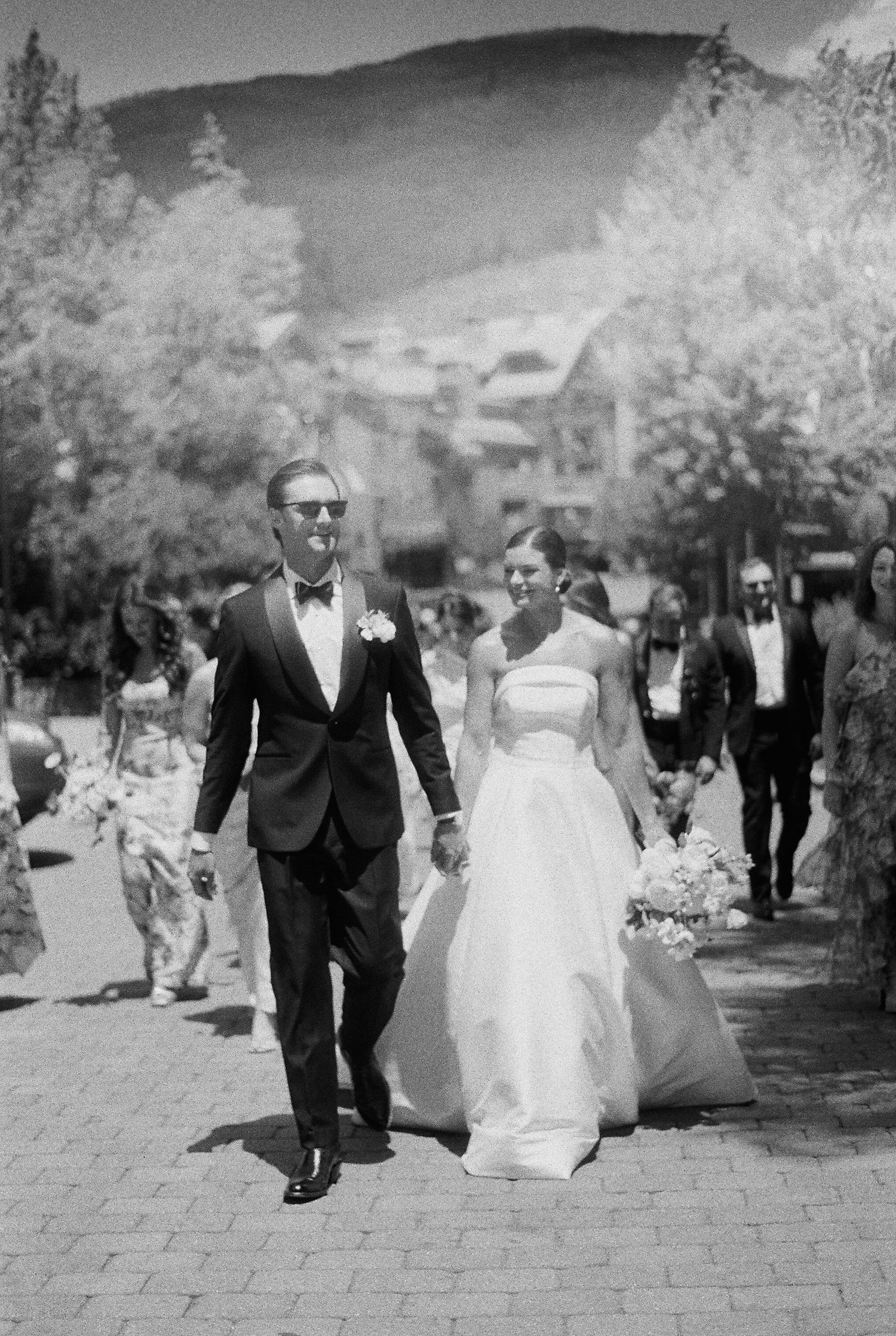 An intimate black and white wedding moment captured in soft focus.