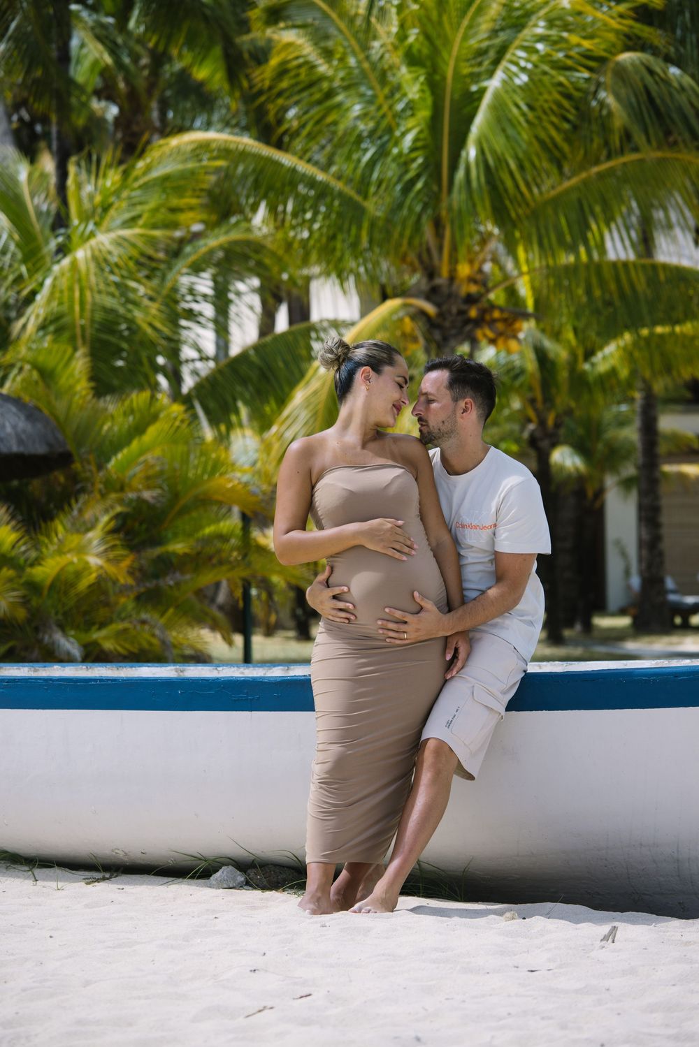 Romantic beach scene with palm trees and white sand creating a tropical paradise backdrop.