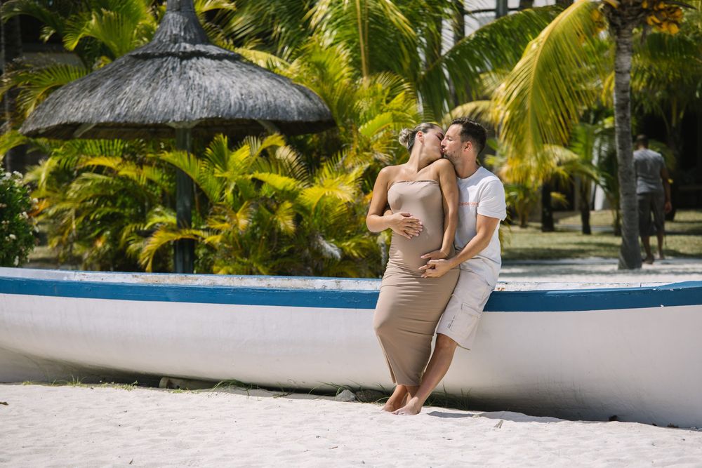 Intimate beachside moments captured under swaying palm trees in a tropical setting.