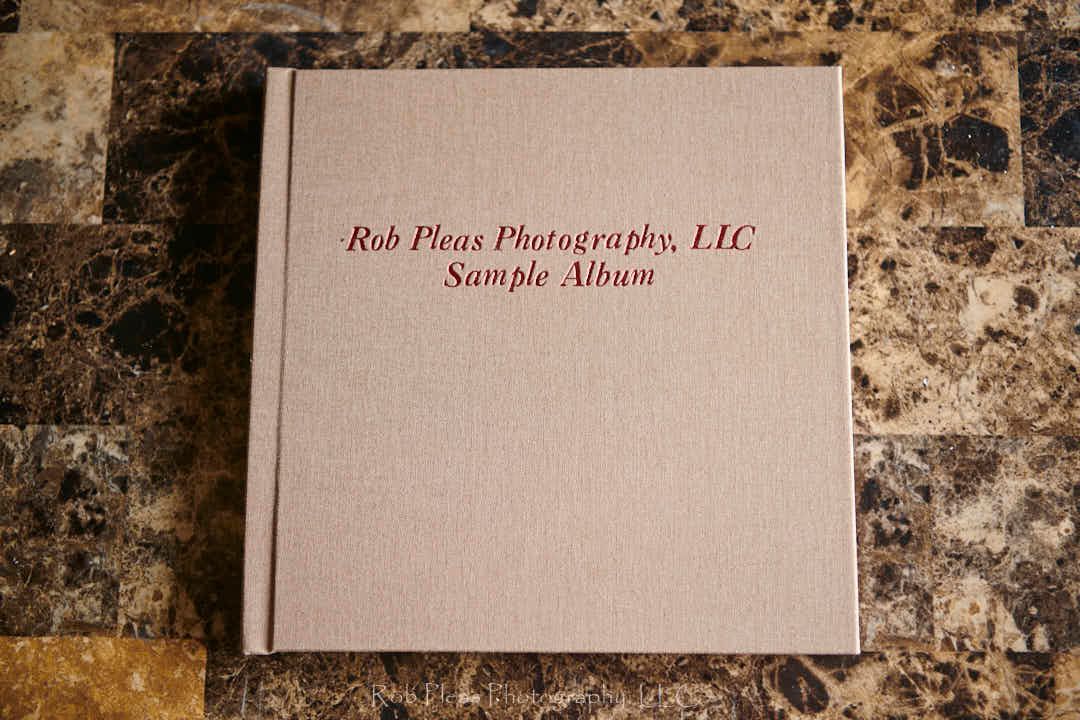 High school Memory album flat on nightstand to show texture and cover imprinting (name across the cover).