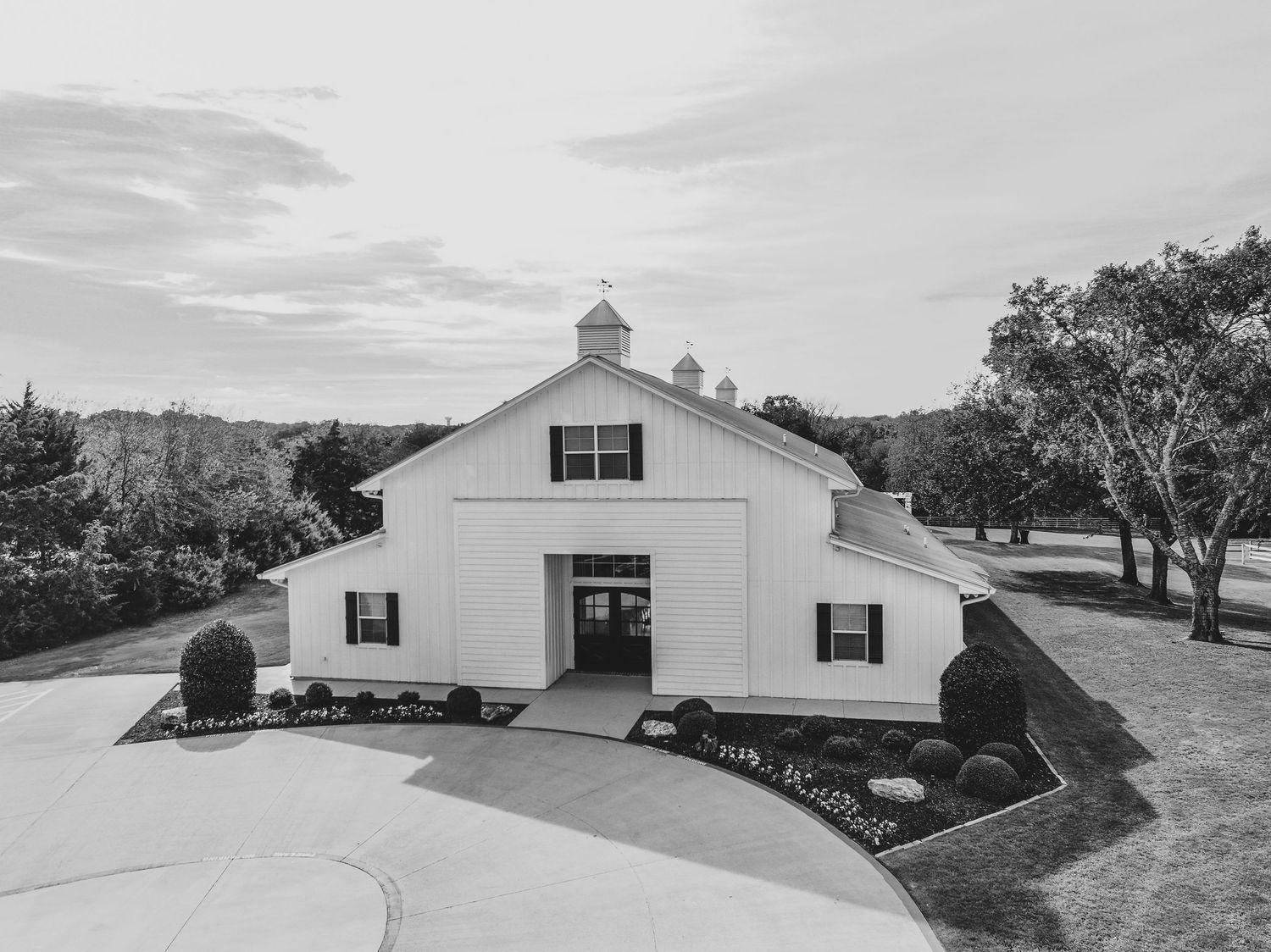 scenic wide drone view of the barn at firefly gardens