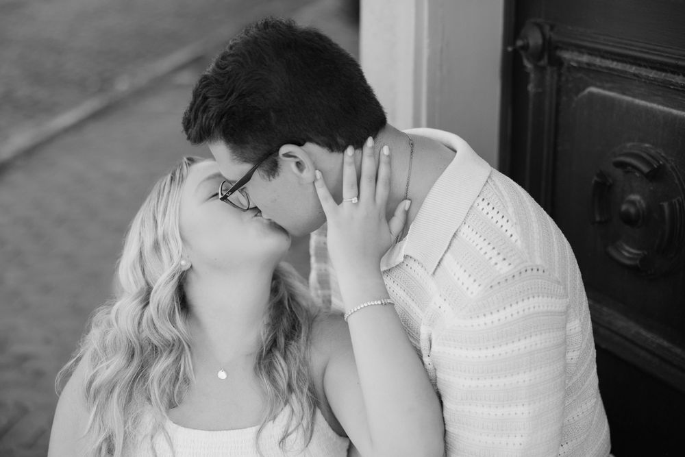 Intimate black and white photo of a couple sharing a tender moment in a romantic embrace. Columbus Ohio Engagement