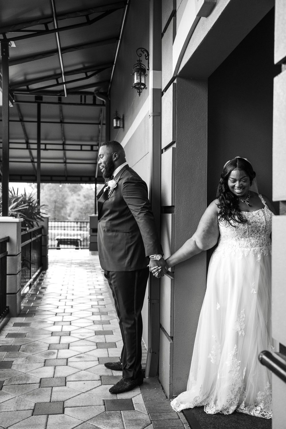 A creative black and white photo sequence showing a couple playfully posing in a covered outdoor hallway at Carollwood Country Club in Tampa