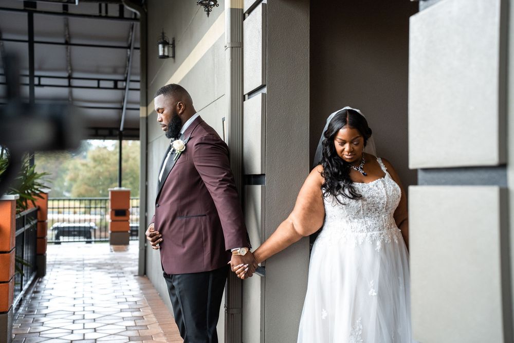 A couple shares an intimate first look moment before their wedding ceremony at Carollwood Country Club in Tampa, Florida