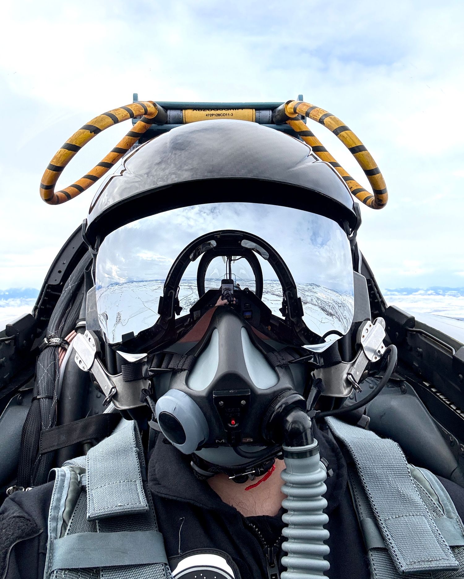 The photographer sitting in the cockpit of a fighter jet on a photoshoot