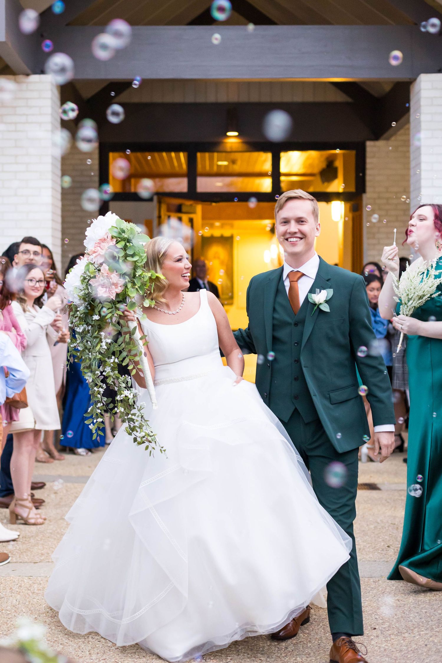 bride and groom exit in bubbles