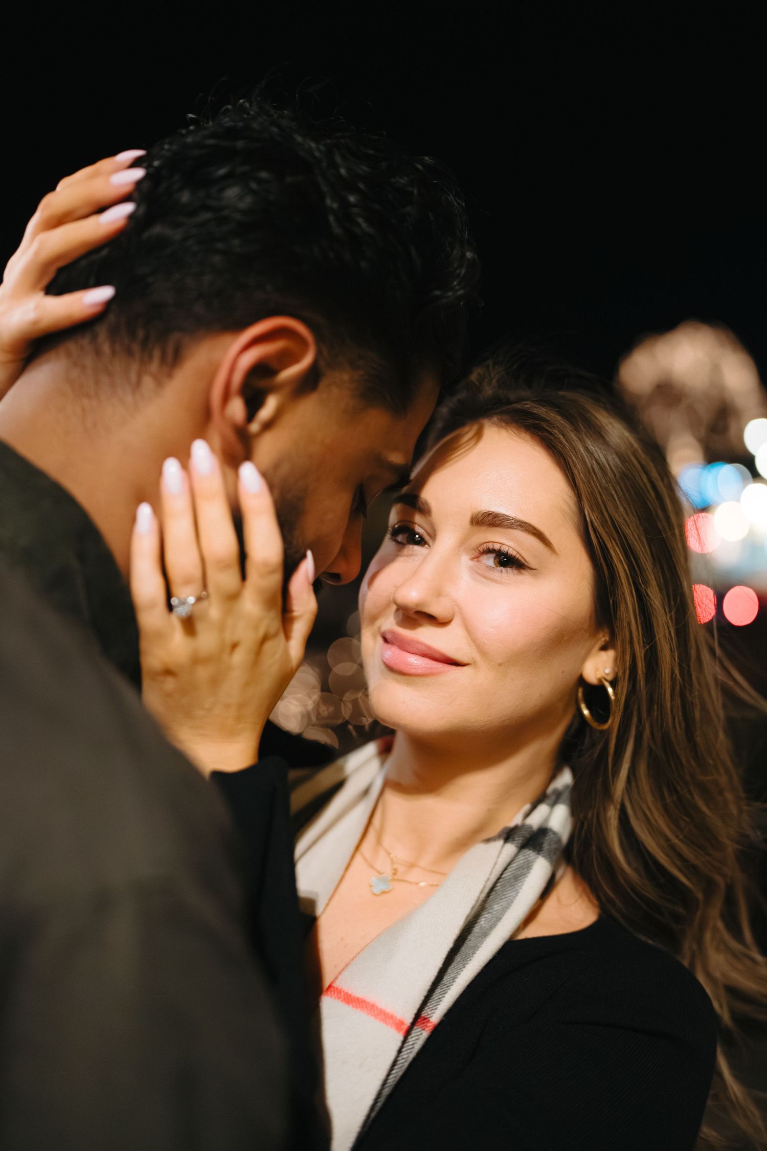 A romantic couple sharing intimate moments and smiles in a series of close-up shots.