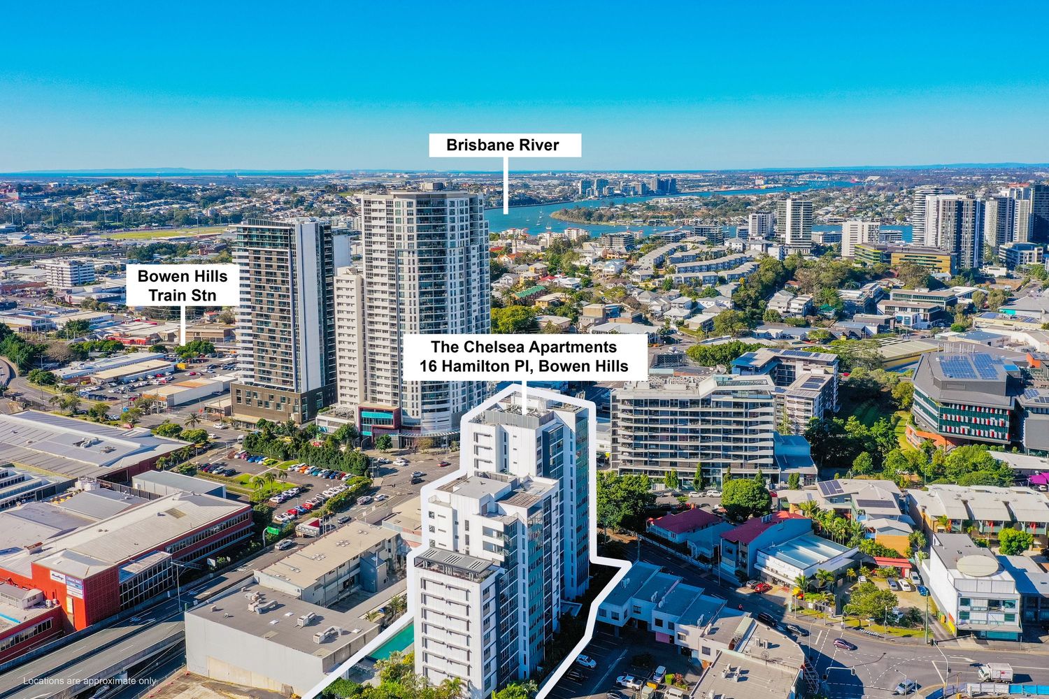 Aerial view of The Chelsea Apartments at 15 Hamilton Pl, Bowen Hills with Brisbane River and CBD backdrop.