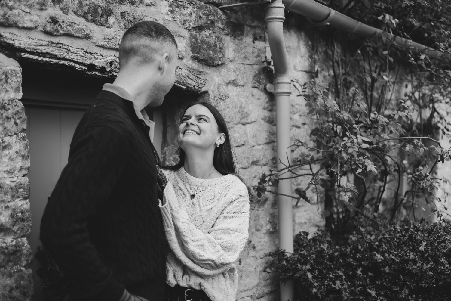 A collection of vintage black and white photographs showing romantic couples in outdoor garden settings.