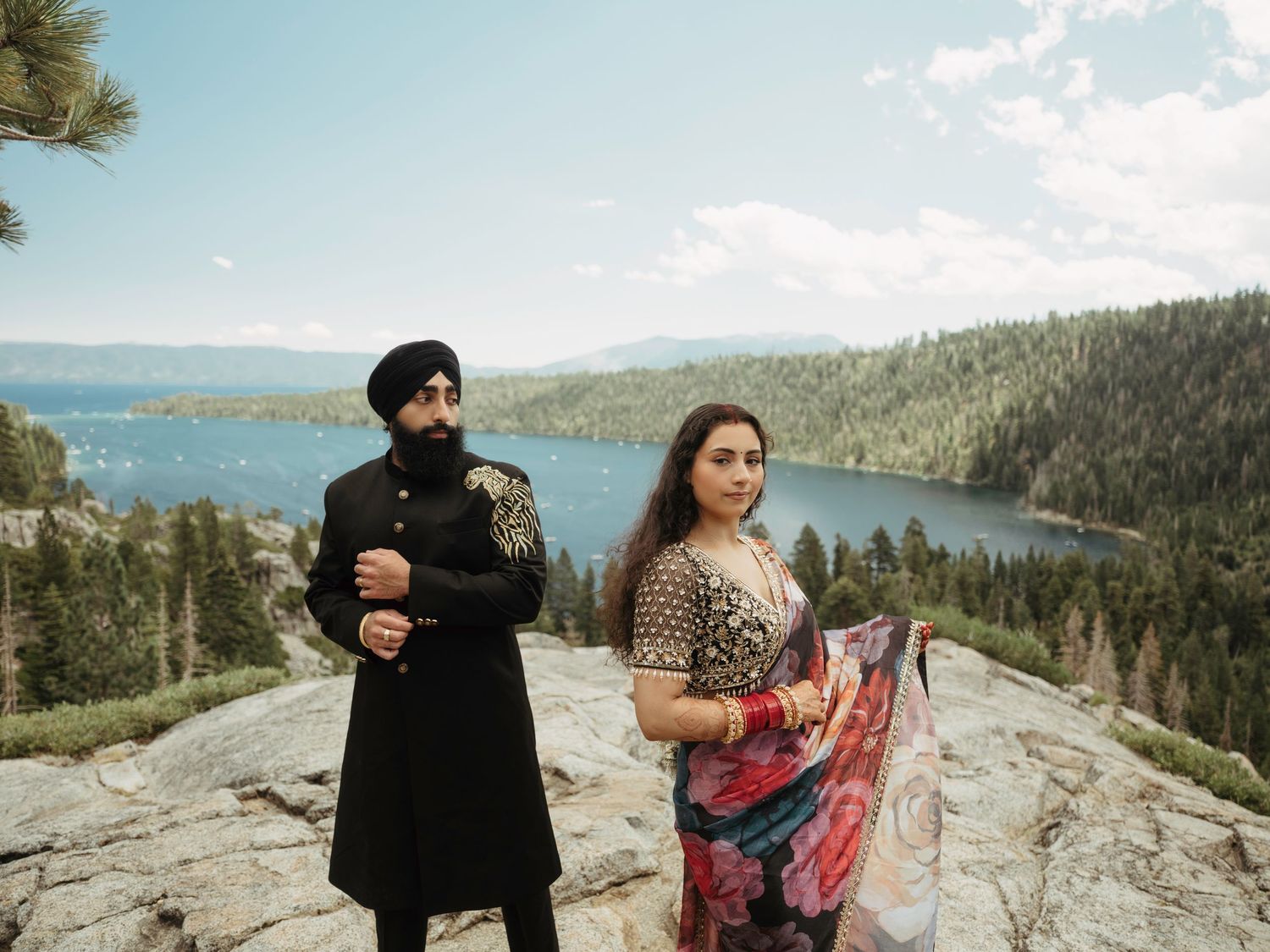 Couple enjoying scenic mountain views at Lake Tahoe during a romantic photoshoot session.