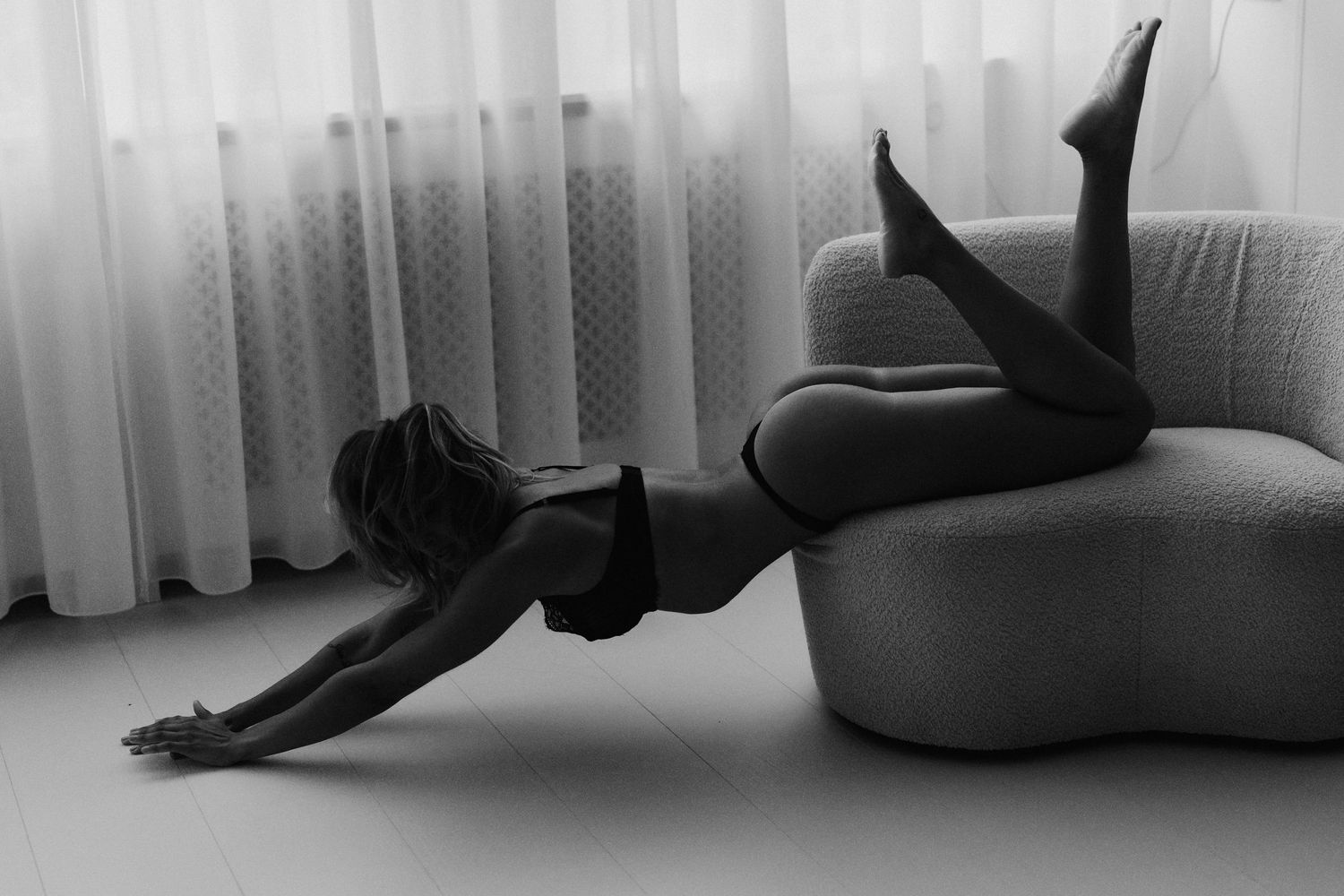 Artistic black and white boudoir poses with dramatic shadows.
