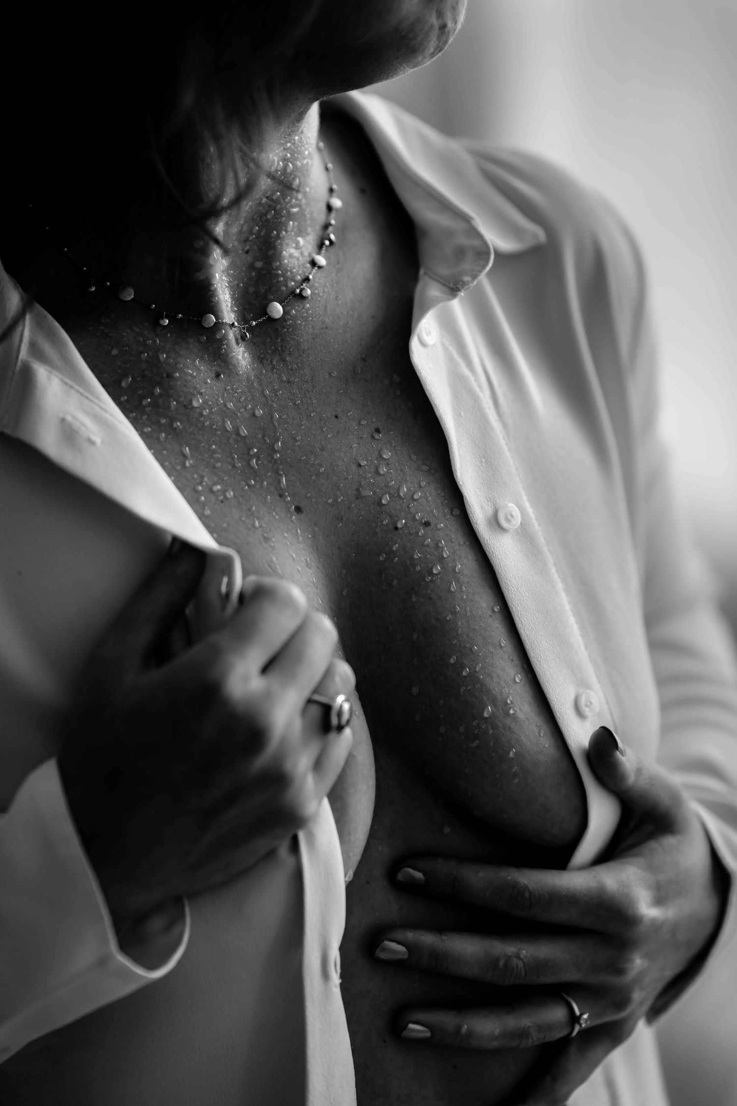 Artistic black and white close-up shots featuring water droplets on skin.