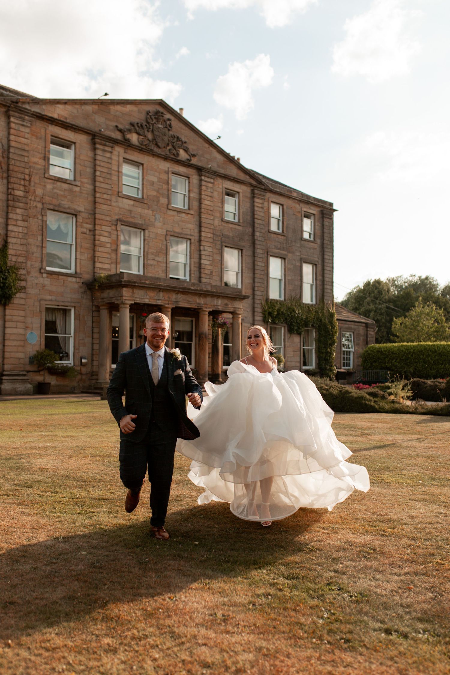 Seven romantic golden hour wedding photos in sequence showing a couple playfully running and twirling on a grassy hilltop.