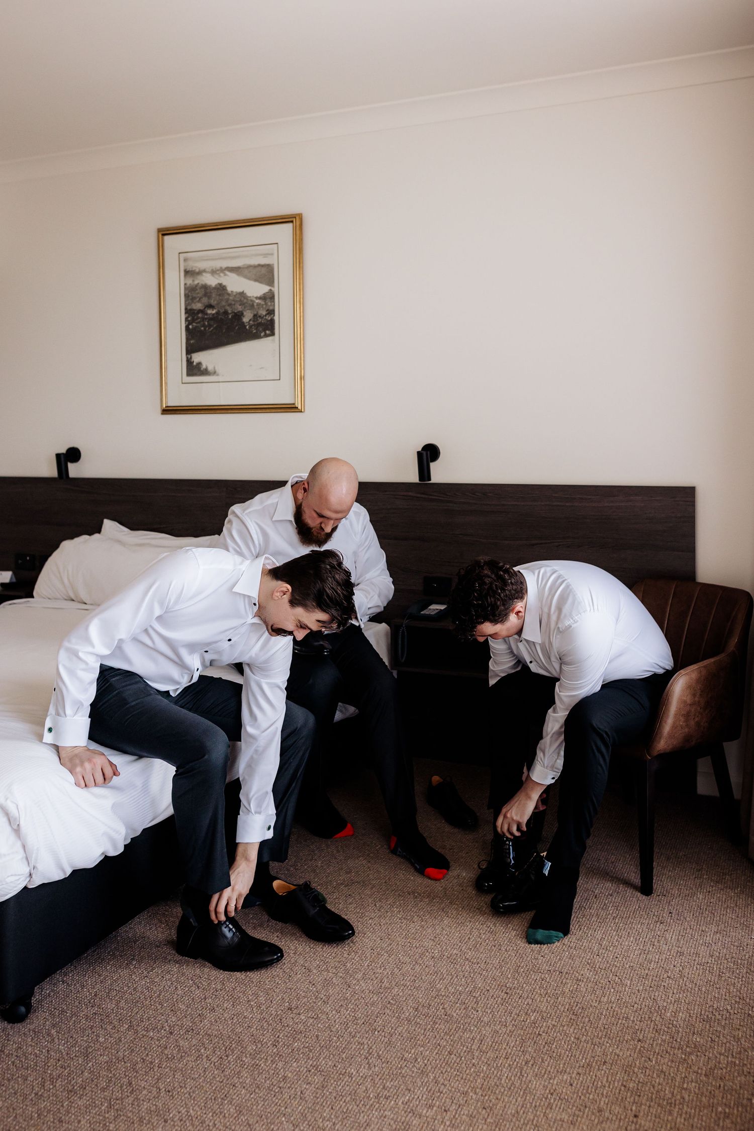 Series of sequential photos shows someone in white dress shirt and dark pants collapsing onto carpet beside black couch.