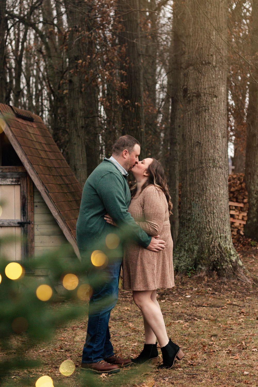 Natural light Christmas portraits focused on authentic family connection. Outdoor holiday family photos taken in a snowy park setting. Holid