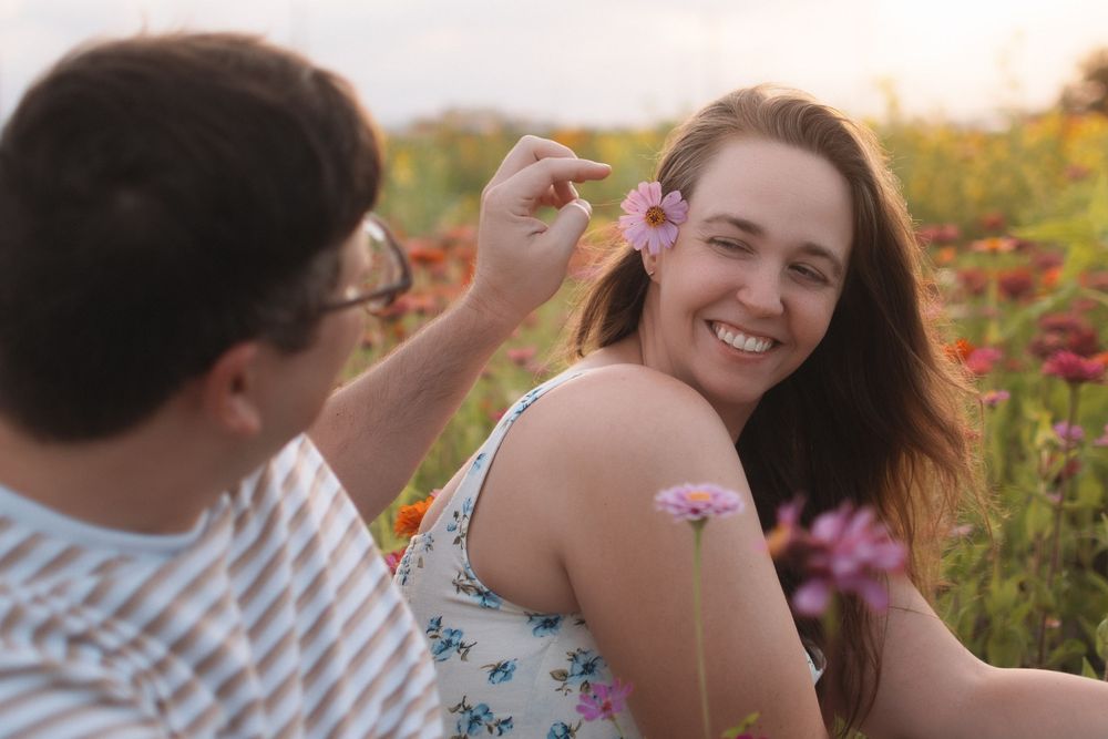 Romantic couple portrait in flower fields at Fancy Farms Market, Plant City, Florida by a Central Florida photographer.