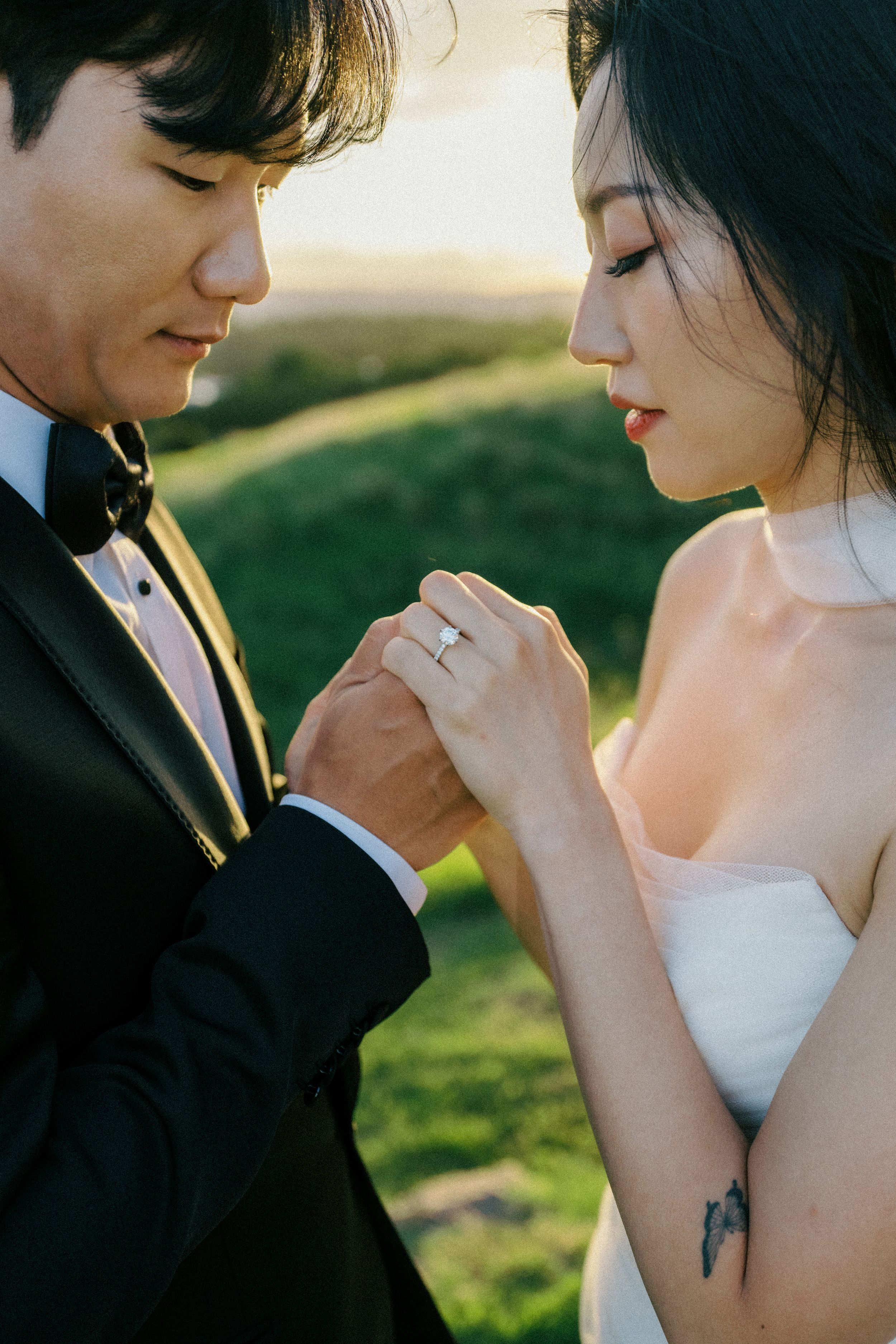 A romantic outdoor wedding moment captured in a series of intimate closeup photos during golden hour.