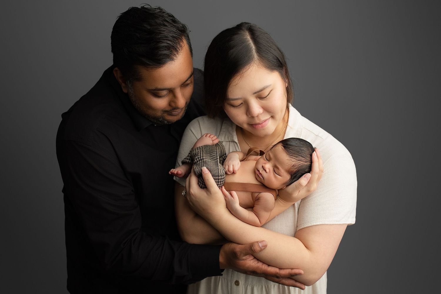 mum and dad, holding baby, hand pose, gentle, natural, minimalist, contemporary artwork, best newborn photographer, in Ipswich Queensland.