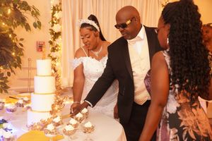 A romantic scene at a wedding reception with warm lighting and elegant decor as the couple shares a special moment together.