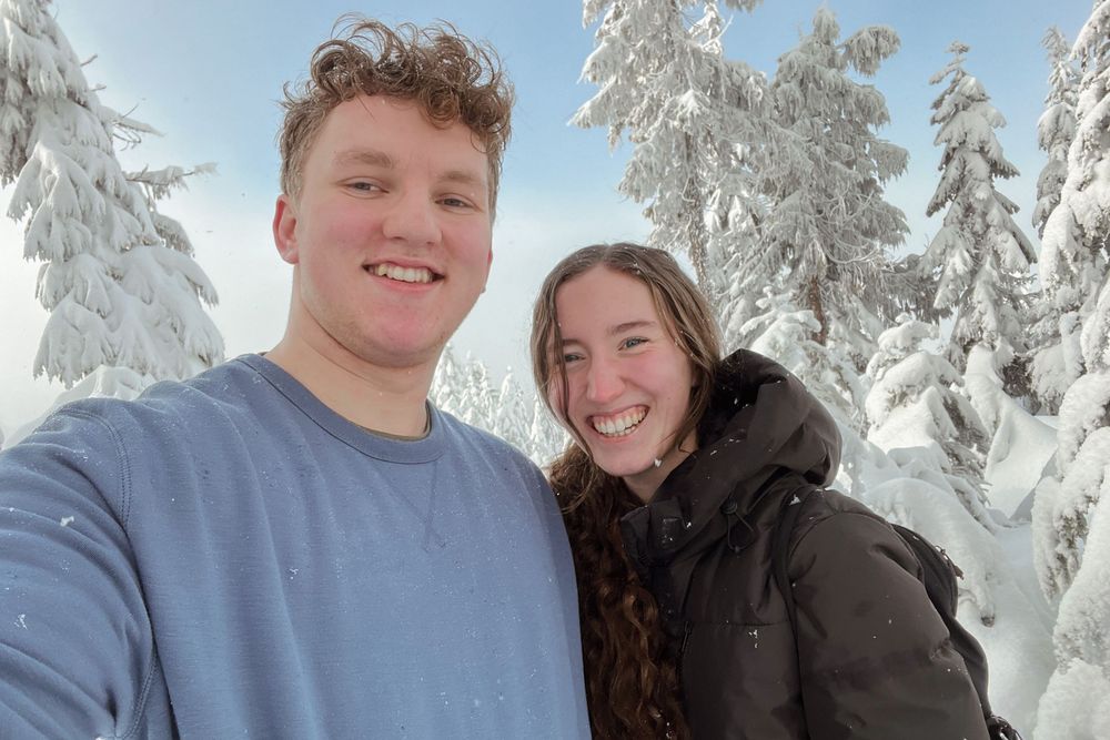 Katie Phillips (Soulfull Photographs) the photographer on Mt. Washington in the snow with her husband taking a selfie