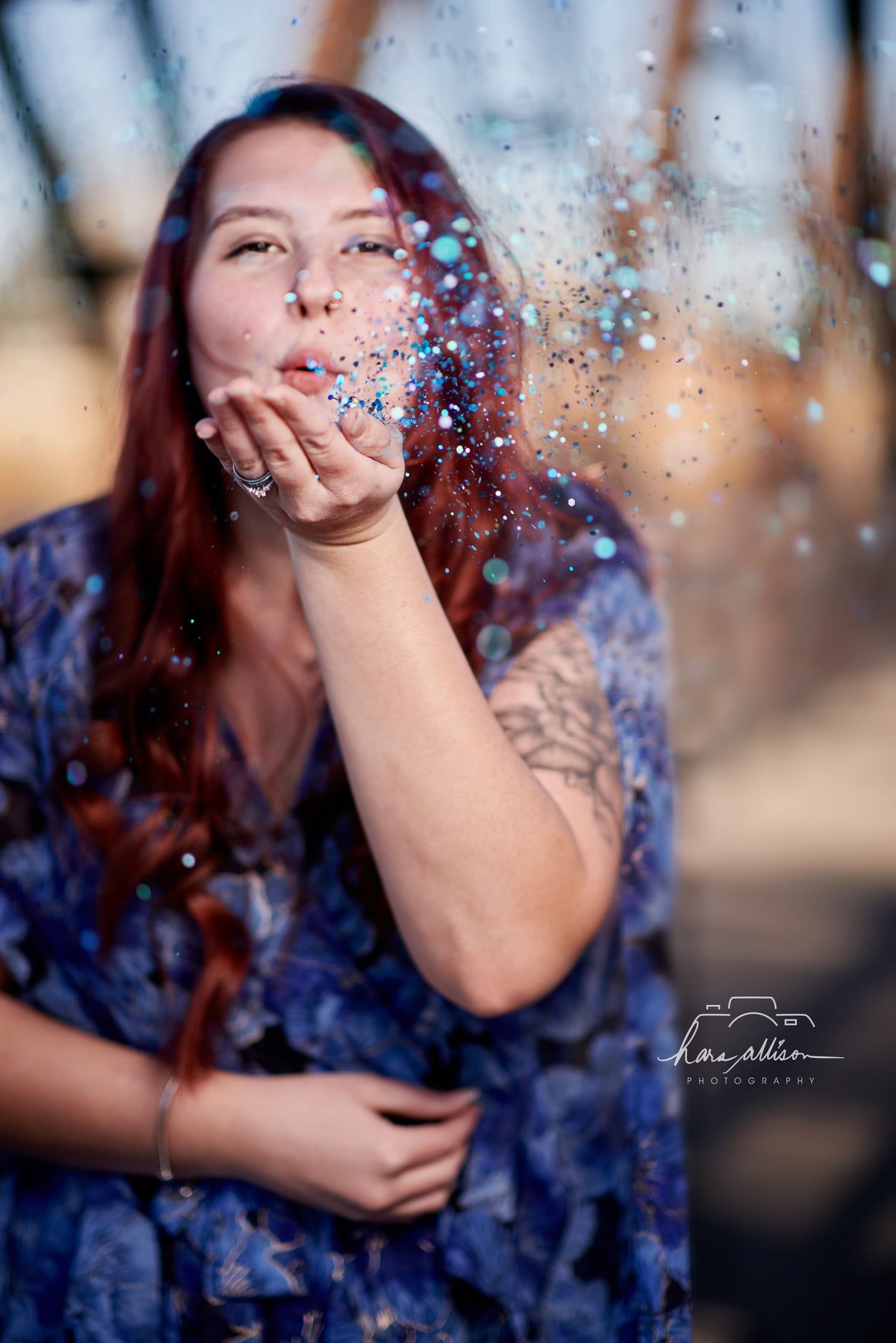 A magical moment captured as glitter sparkles are blown into the sunlit air.