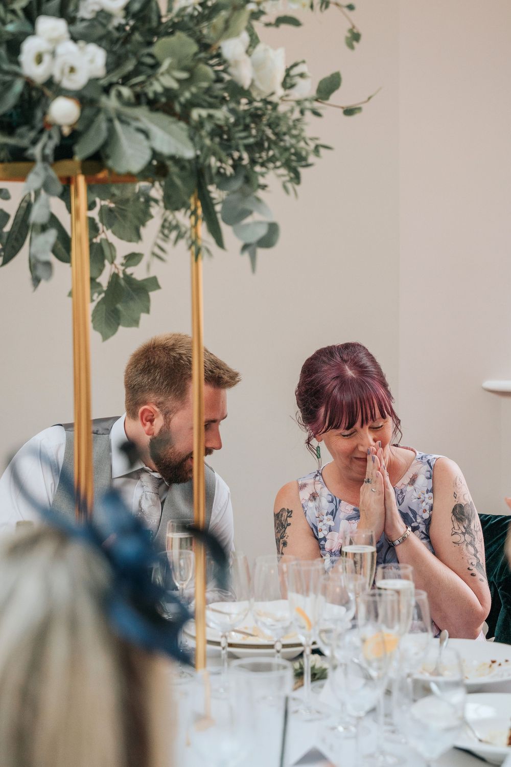 Wedding guests reacting to emotional speeches at Rockbeare Manor