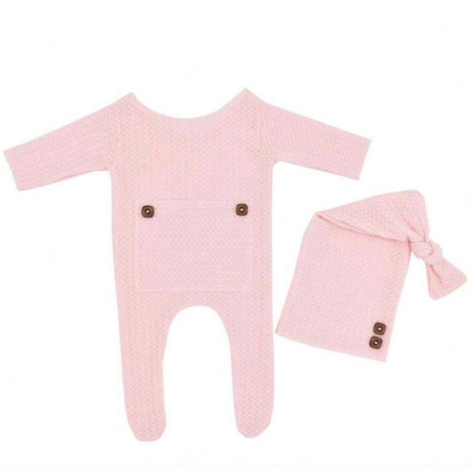 Pink baby clothing set laid flat on white background.