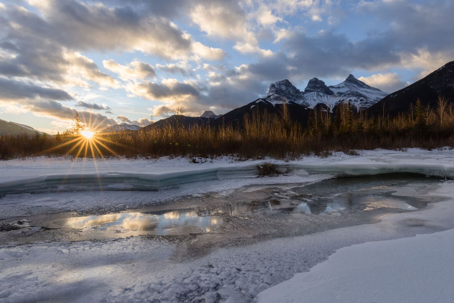 The three sisters of Canmore, a mountain sunrise scape on a frosty morning, in Alberta, Canada