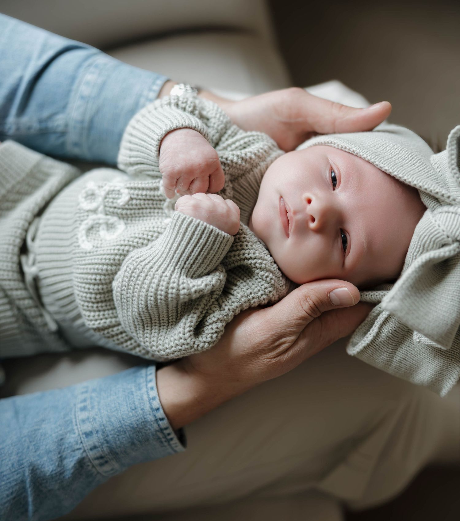 Close-up portraits showing gentle expressions and warm moments while wearing soft knit clothing.