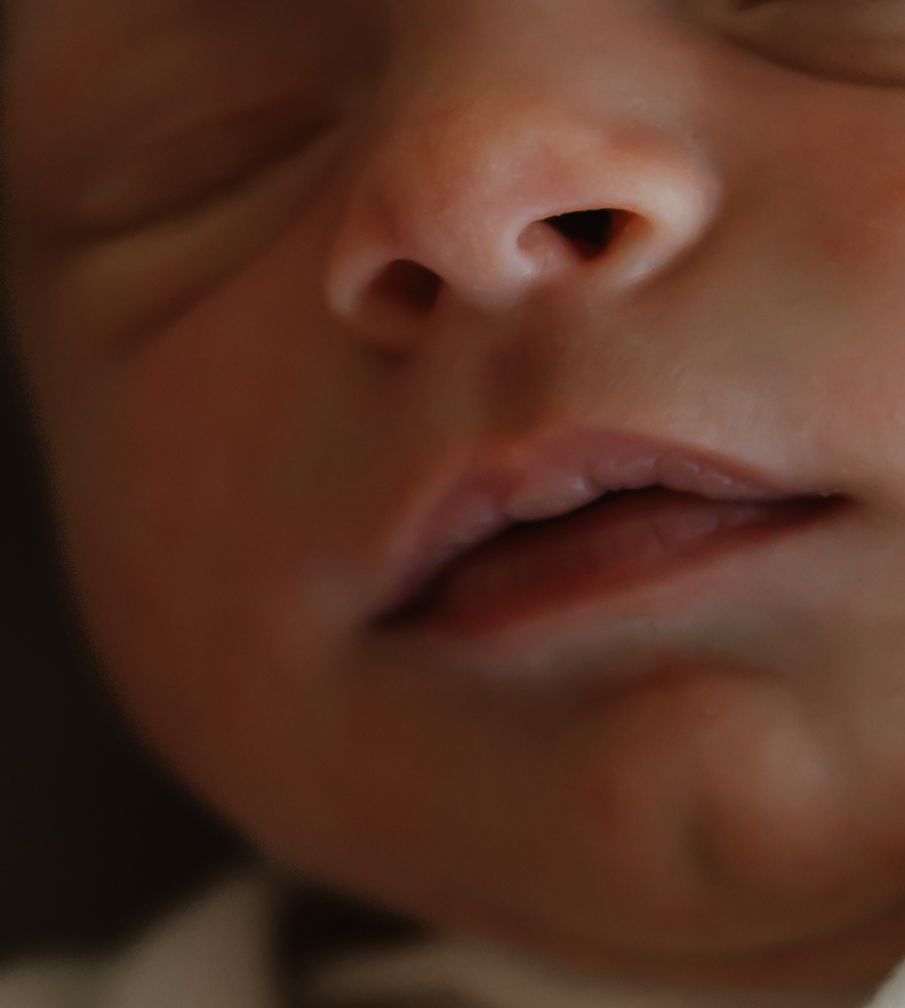 Close-up sequence of a baby's mouth and lips showing various expressions and movements.