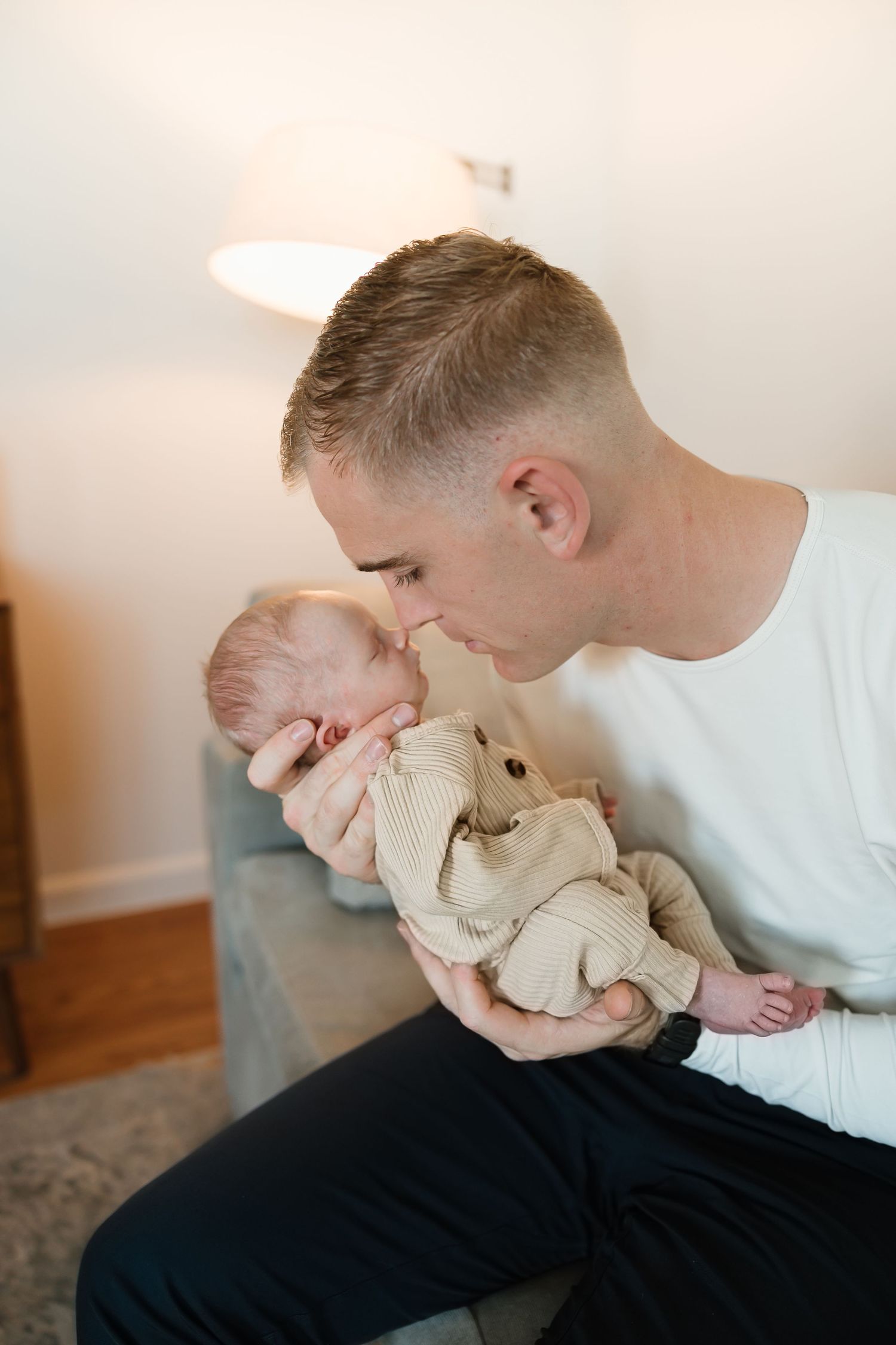A sequence of intimate photos showing a parent sharing sweet moments with their baby and a stuffed animal.