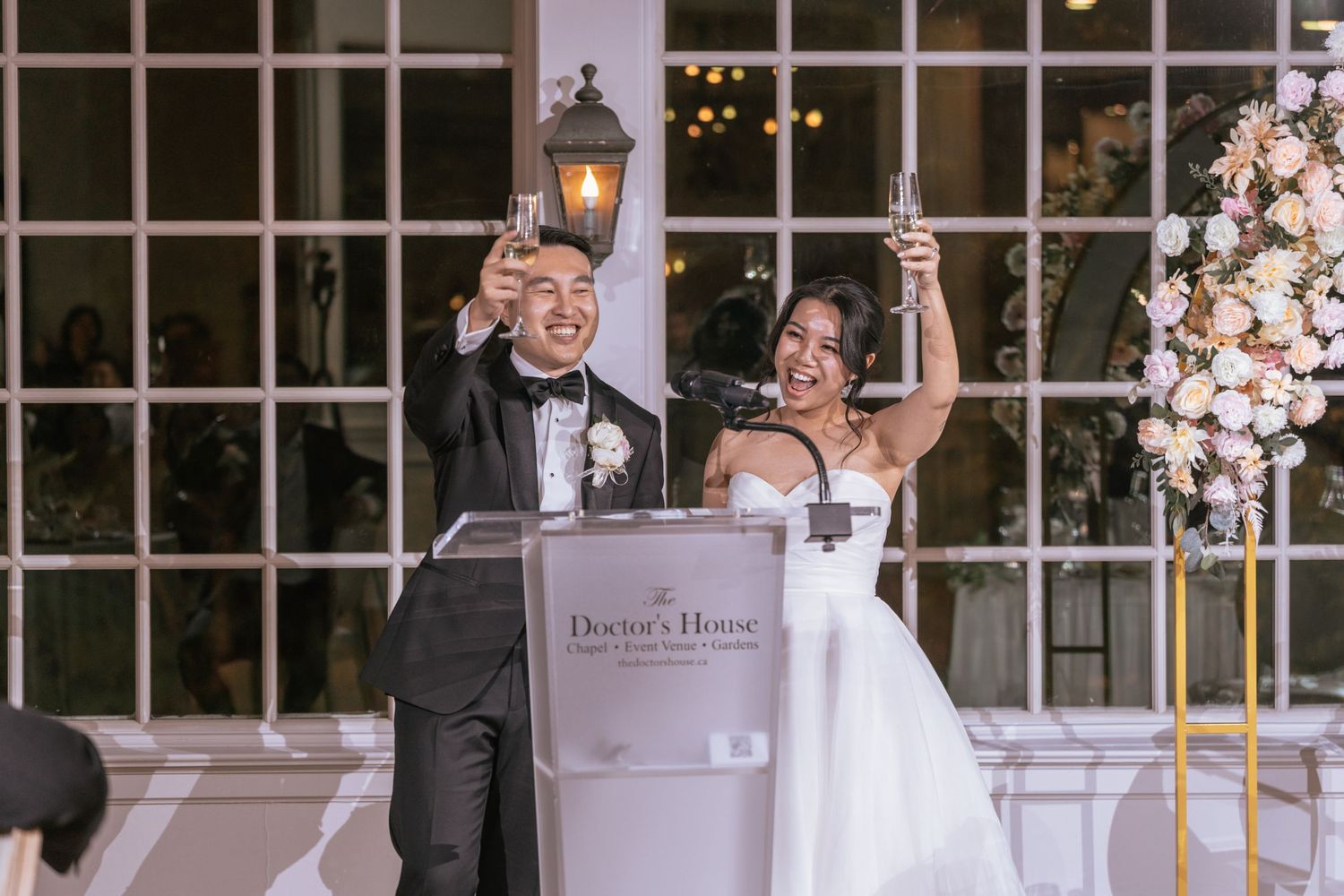 Bride and groom sharing a romantic moment in a golden elevator, dressed in wedding attire.