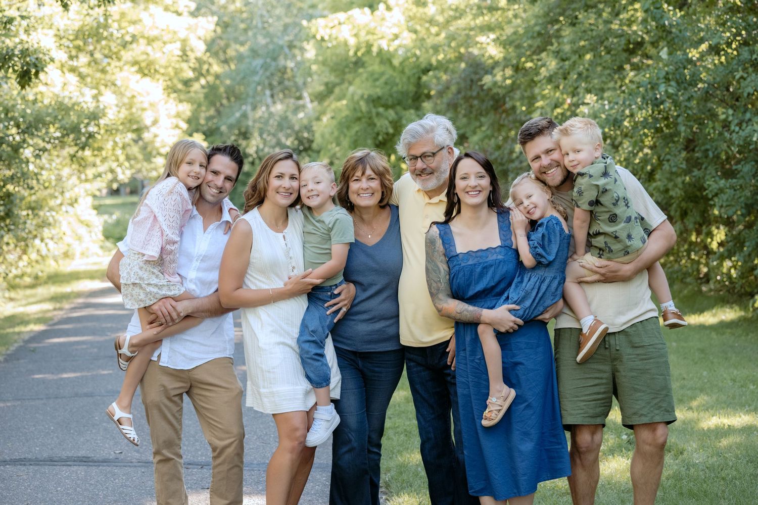 closeup of full multi generational family during portrait session at powers lake park in woodbury mn