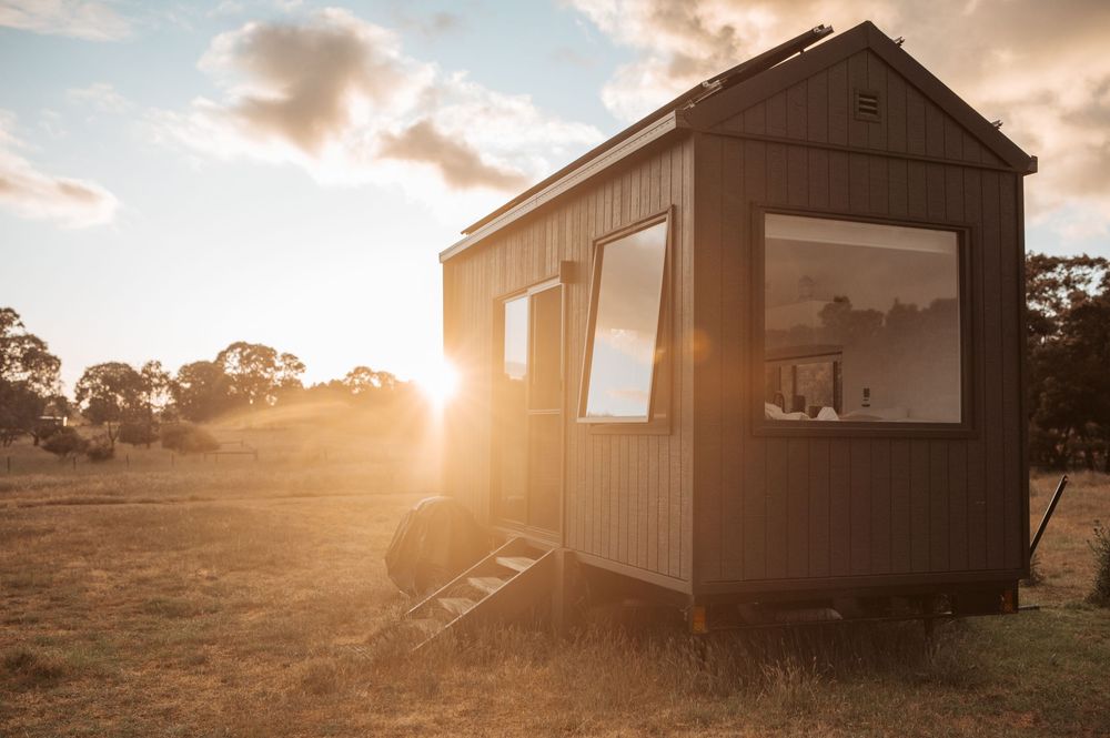 Tiny home accommodation photography capturing golden hour light and off-grid luxury stay in regional Victoria