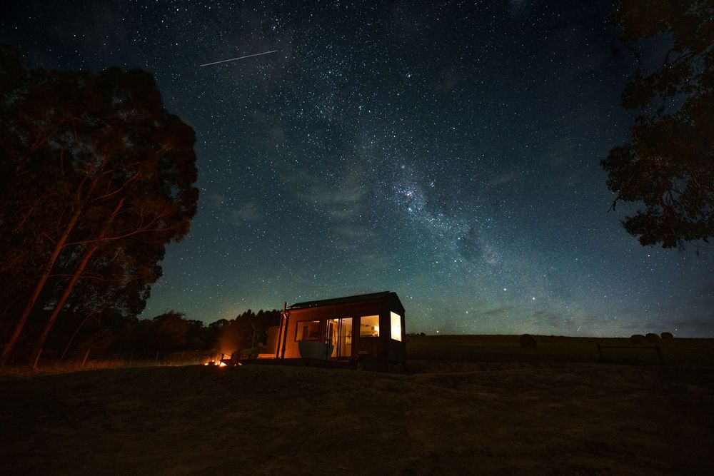 Astro photography of luxury tiny home accommodation beneath the Milky Way in regional Victoria