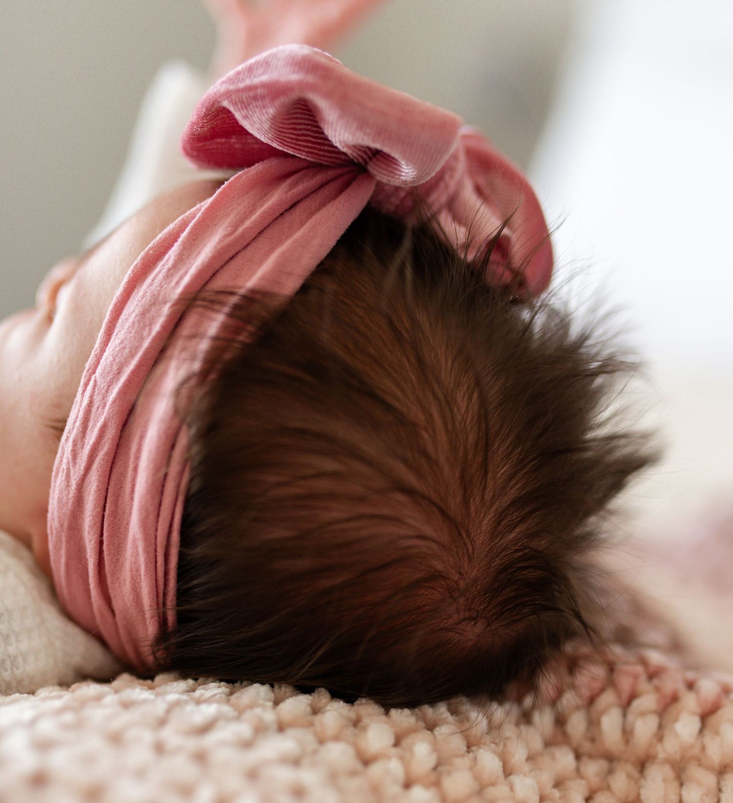 Close up shot of tiny newborn baby hair during a lifestyle photography session in O'Fallon MO