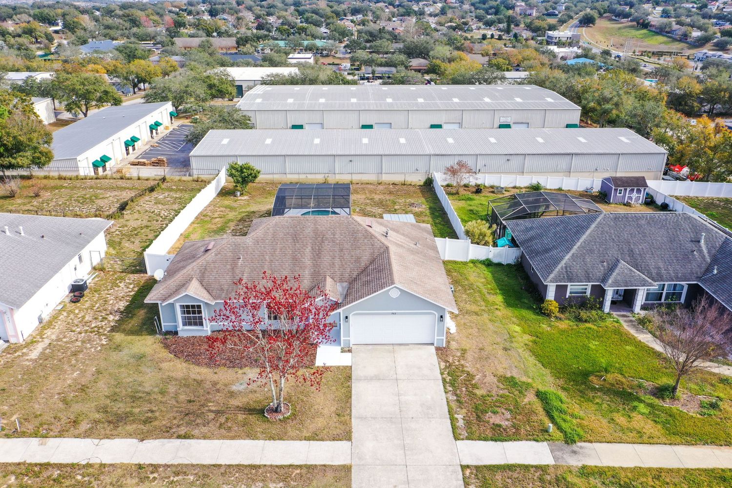 Aerial view of residential neighborhood showing houses and buildings from above.