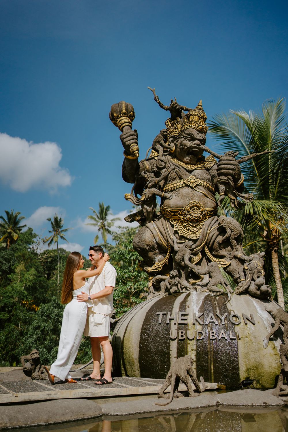 Scenic shots at The Kayon resort featuring traditional Balinese architecture and sculptures.