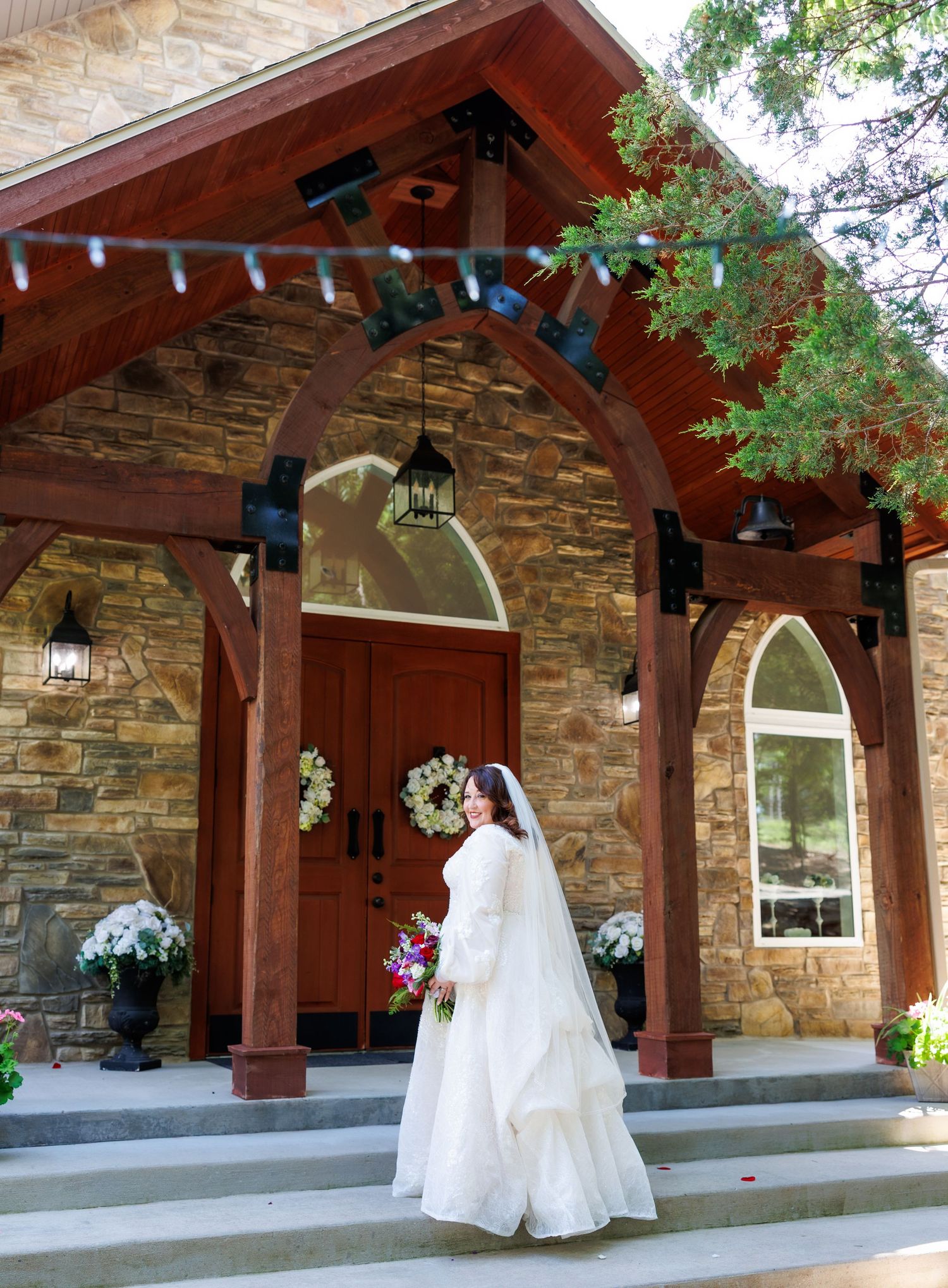 A sequence of images showing a bride in a white wedding dress walking under a rustic wooden and stone portico at Dooley's Chapel in Branson.
