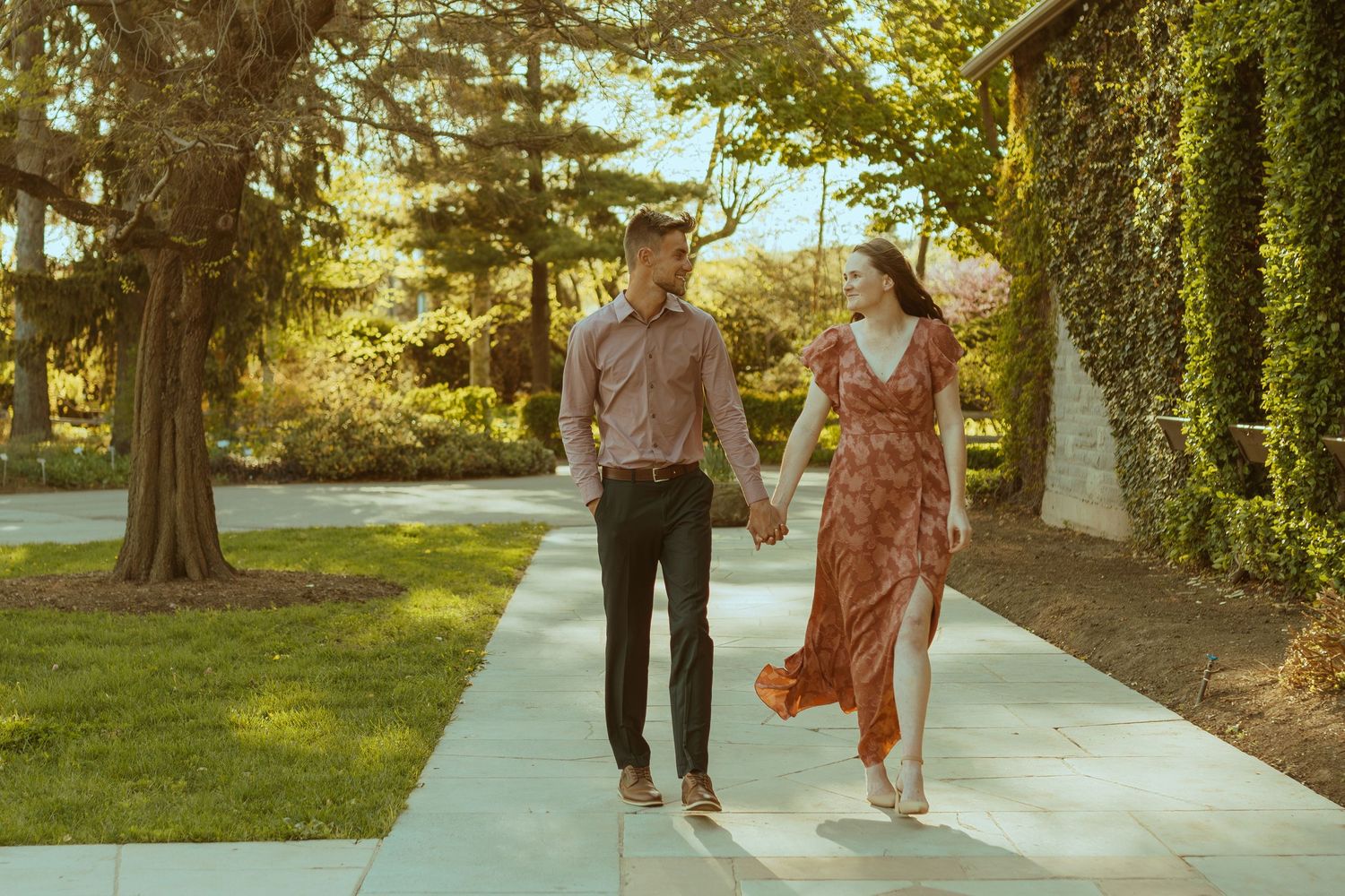 A sequence of photos showing a couple walking together on a tree-lined pathway in warm evening light.